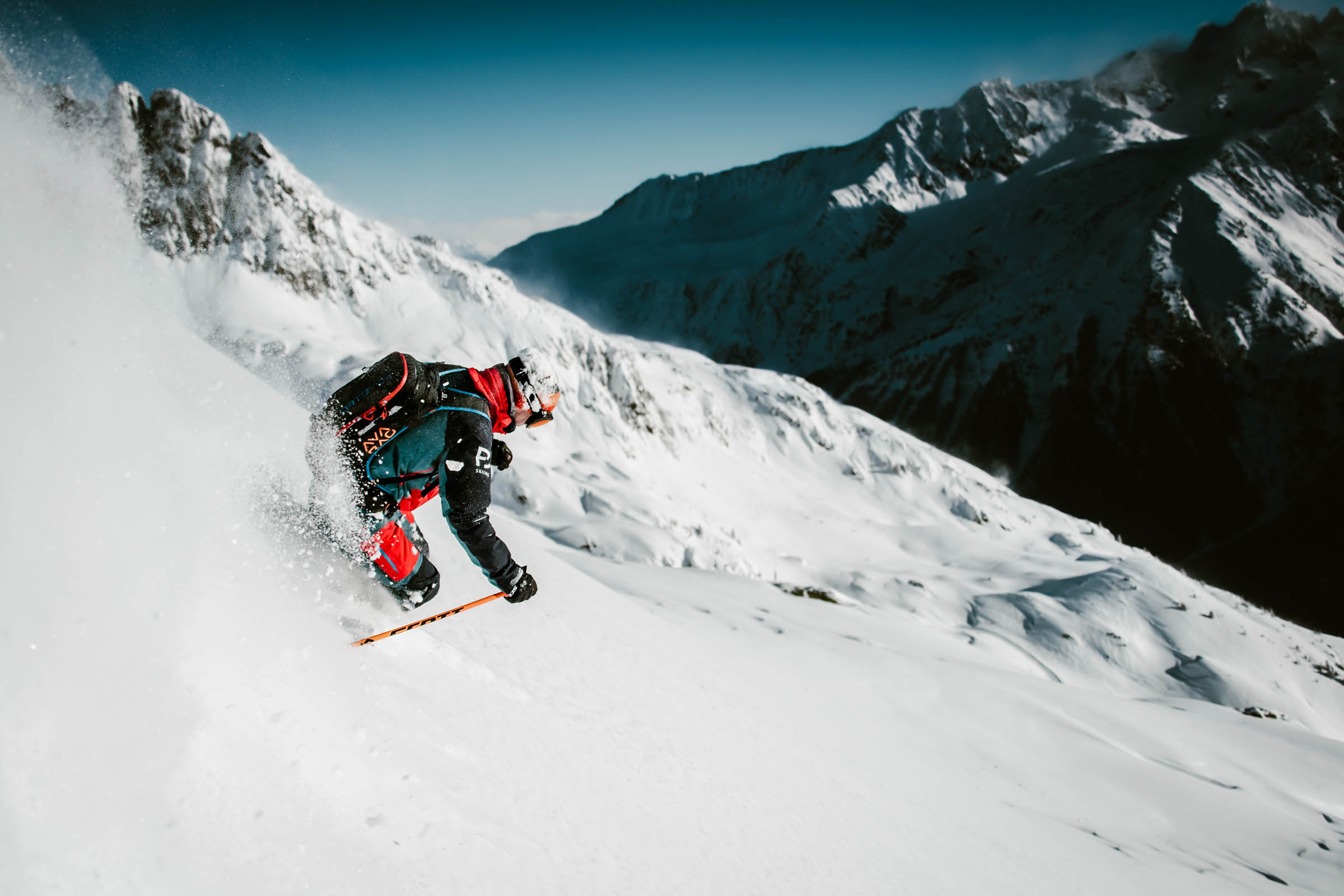 A person skis down the mountain.