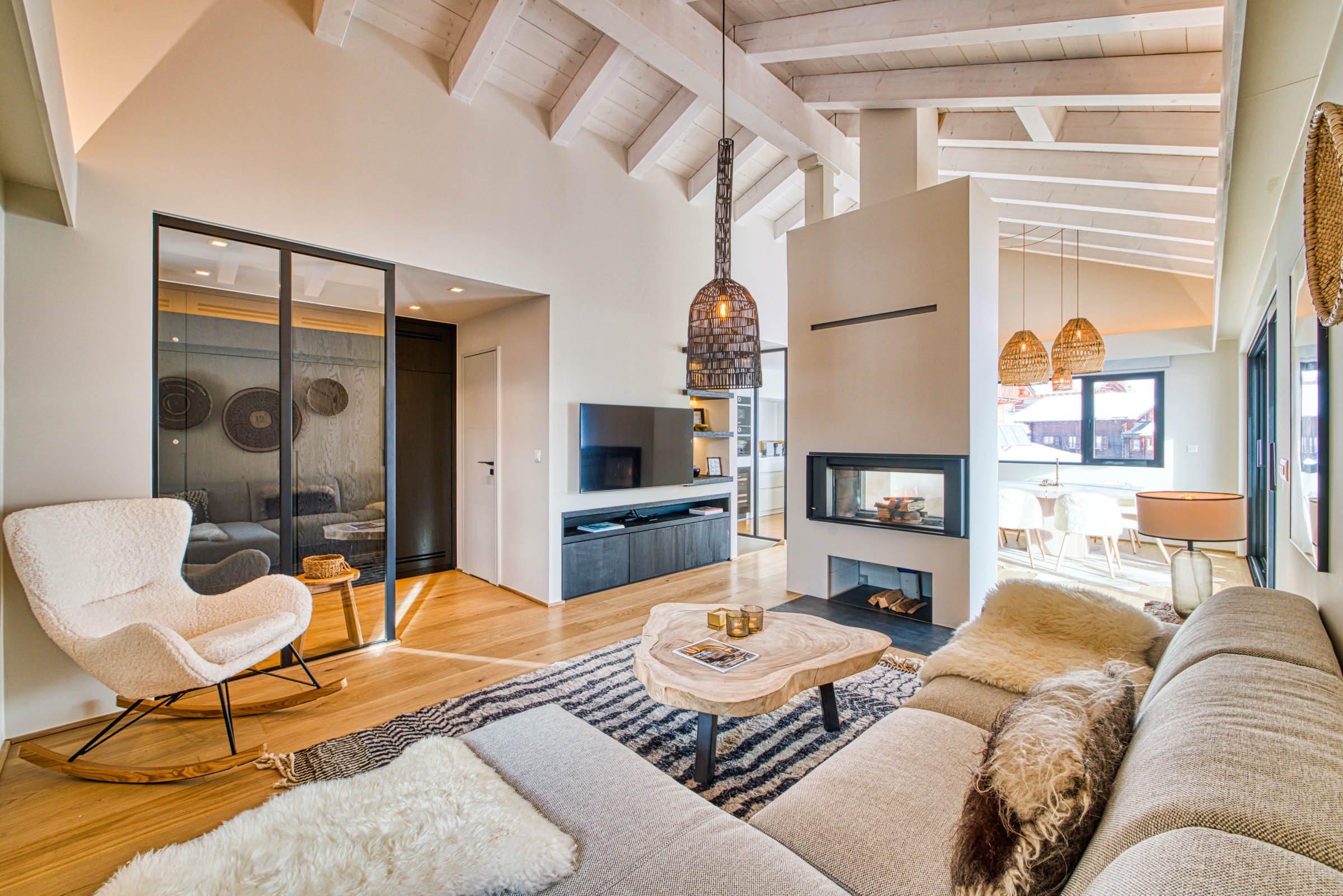 This is a photo of Home Decor, Living Room, Furniture, Indoors, Room, Building, Architecture, Interior Design, Table, Coffee Table, Rug, Monitor, Screen, Hardware, Electronics, Computer Hardware