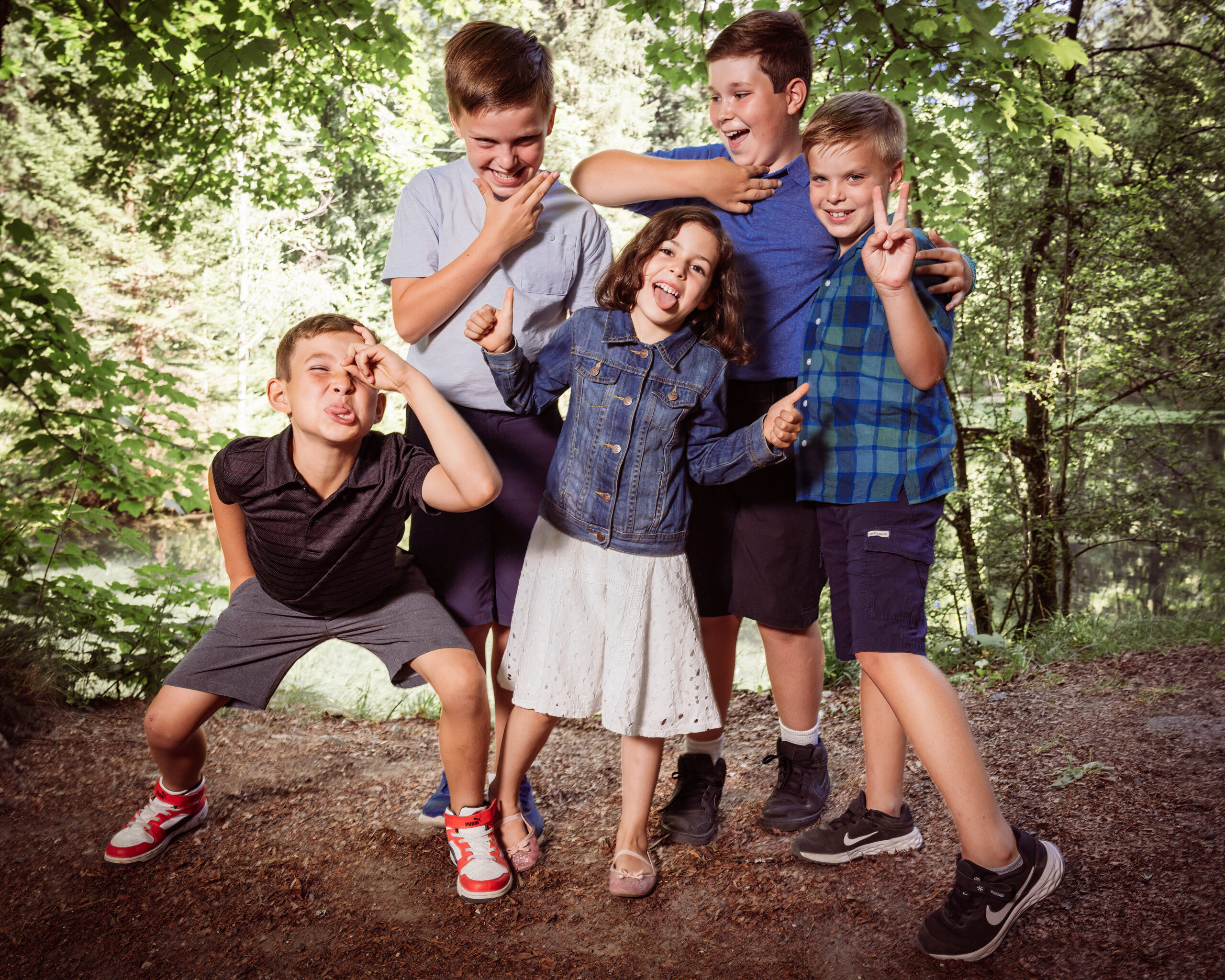 This is a photo of People, Person, Clothing, Shorts, Footwear, Shoe, Face, Head, Photography, Portrait, Pants, Child, Female, Girl, Plant, Tree, Boy, Male, Vegetation, Grass, Nature, Outdoors, Park, Happy, Coat, Smile, Laughing, Groupshot
